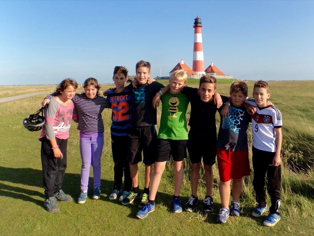 a group of kids posing for a photo